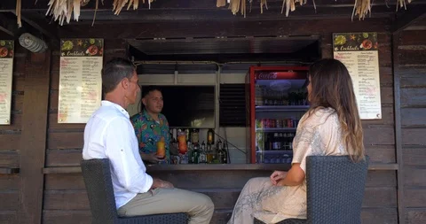 Bartender Gives Drinks to Couple at Beach Bar, Tropical Resort Stock Footage 103220436