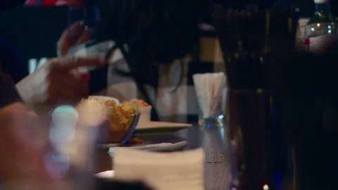 The bartender gives out three glasses of beer to the bar customer telephoto Stock Footage 155984155