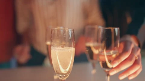 Bartender hand pouring champagne glasses at terrace closeup. Friends toasting Stock Footage 252000808