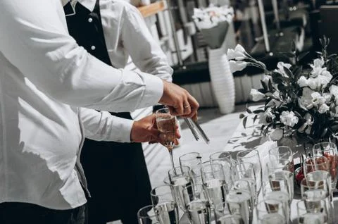 Bartender hands, bartender makes cocktail at party Photos