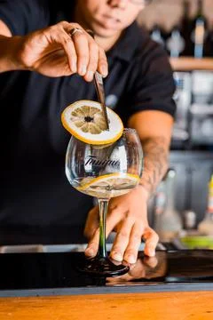Bartender Hands Making a Perfect Drink on Bar Gin Tonic Negroni Caipirinha Mosco Stock Photos