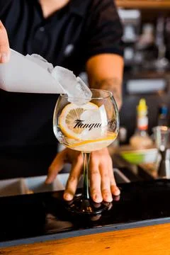 Bartender Hands Making a Perfect Drink on Bar Gin Tonic Negroni Caipirinha Mosco Stock Photos