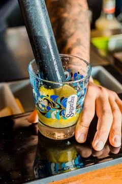 Bartender Hands Making a Perfect Drink on Bar Gin Tonic Negroni Caipirinha Mosco Stock Photos