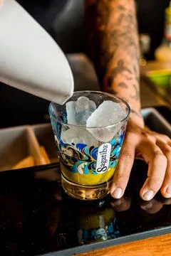 Bartender Hands Making a Perfect Drink on Bar Gin Tonic Negroni Caipirinha Mosco Stock Photos