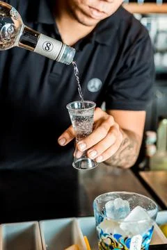 Bartender Hands Making a Perfect Drink on Bar Gin Tonic Negroni Caipirinha Mosco Stock Photos