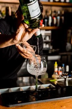 Bartender Hands Making a Perfect Drink on Bar Gin Tonic Negroni Caipirinha Mosco Stock Photos