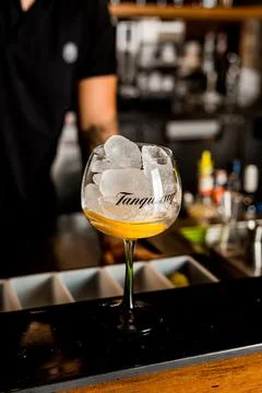 Bartender Hands Making a Perfect Drink on Bar Gin Tonic Negroni Caipirinha Mosco Stock Photos