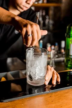 Bartender Hands Making a Perfect Drink on Bar Gin Tonic Negroni Caipirinha Mosco Stock Photos