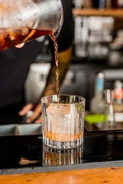 Bartender Hands Making a Perfect Drink on Bar Gin Tonic Negroni Caipirinha Mosco Stock Photos