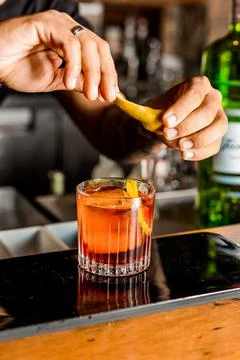 Bartender Hands Making a Perfect Drink on Bar Gin Tonic Negroni Caipirinha Mosco Stock Photos