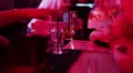 Bartender hands pouring drink, serving clients, nightclub bar HD Footage