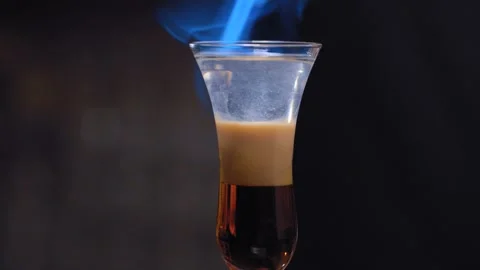 Bartender hands setting fire to cocktail B-52 Stock Footage 131438528