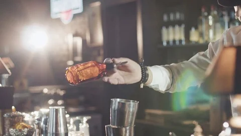 Bartender in hat is preparing cocktail in bar Stock Footage 75231785