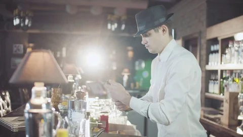 Bartender in hat is preparing cocktail in bar Stock Footage 75241131