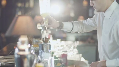 Bartender in hat is preparing cocktail in bar Stock Footage 75241254