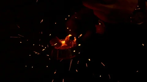 Bartender lights a hookah in slow motion, coals are heating up in the dark Stock Footage 129486258