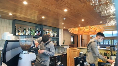 A bartender makes a cocktail over the bar counter Stock Footage 149898240