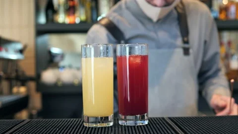 A bartender makes a cocktail over the bar counter Stock Footage 149898339