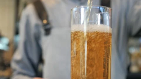 A bartender makes a cocktail over the bar counter Stock Footage 149898355
