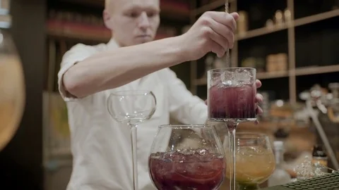 Bartender makes a cocktails close-up Stock Footage 76558866