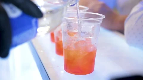 The bartender makes cocktails in gloves during quarantine. Stock Footage 147207728