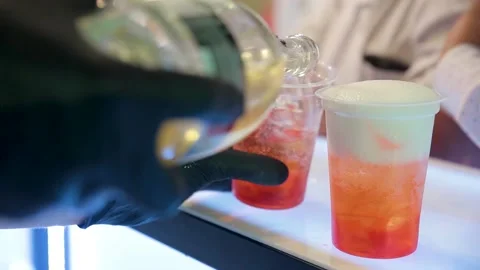 The bartender makes cocktails in gloves during quarantine. Stock Footage 147207772