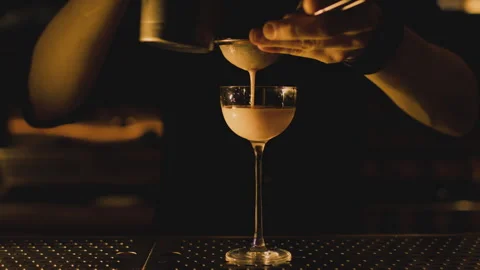 Bartender makes elegant cocktail tonight Stock Footage 265001178