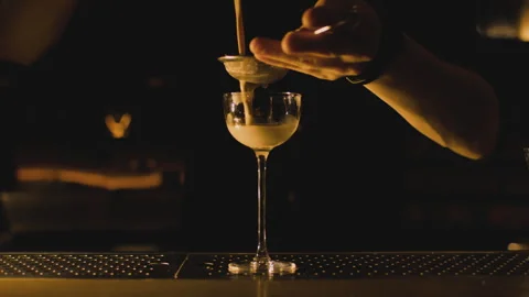 Bartender makes elegant cocktail tonight Stock Footage 265001234