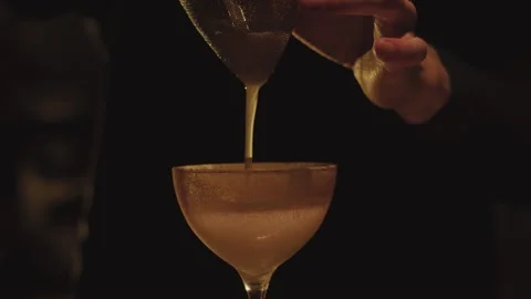 Bartender makes elegant cocktail tonight Stock Footage 276627700