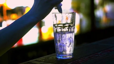 Bartender, makes a great cocktail. A man is preparing a drink. Alcohol. Party Stock Footage 84530869