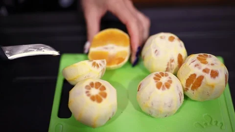 Bartender makes healthy orange juice Stock Footage 117428608