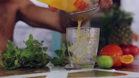 Bartender makes homemade fruit tea Stockbeeldmateriaal 74709251