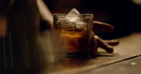 Bartender makes a old fashioned in atmospheric lighting (montage) Video stock 136498147