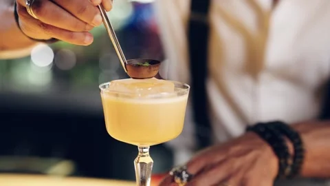 Bartender making and decorating a sour cocktail with matcha tea Stock Footage 337885395