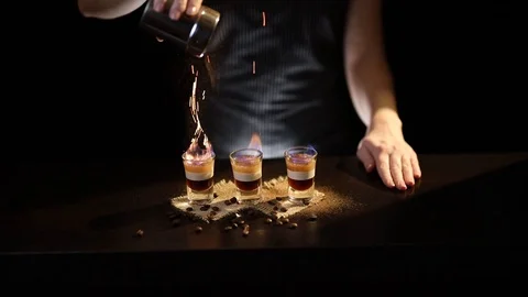 Bartender making B 52 cocktail Stock Footage 124586006