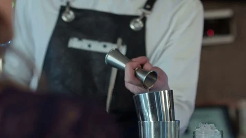 Bartender is making cocktail at bar counter at night club Stock-Footage 76597180