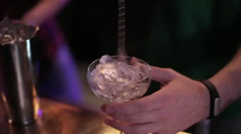 Bartender making a cocktail at the bar Stock Footage 61838609