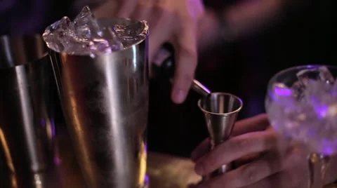 Bartender making a cocktail at the bar Stock Footage 61838722