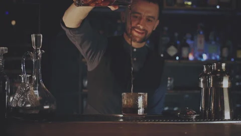 Bartender making a cocktail at the bar Stock Footage 167393902