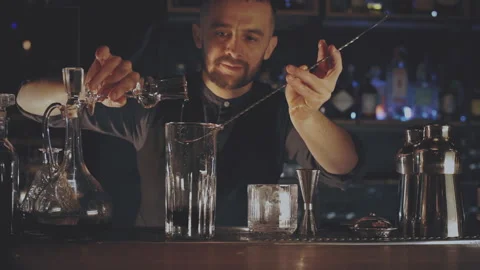 Bartender making a cocktail at the bar Stock Footage 167535833