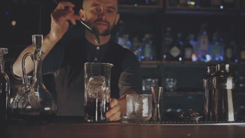 Bartender making a cocktail at the bar Stock Footage 168197996