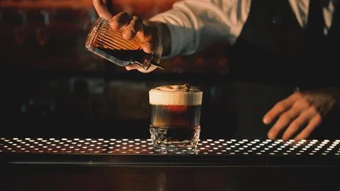 Bartender making a cocktail at the bar Stock Photos