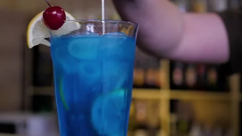 Bartender making cocktail at bar table in restaurant Stock Footage 105646839