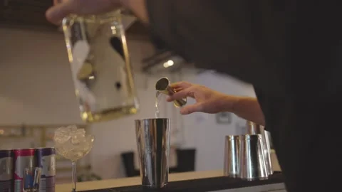 A Bartender making cocktail drink at a bar 스톡 동영상 155460895