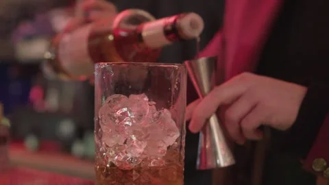 Bartender making cocktail with ice in bar close up Video stock 330814759