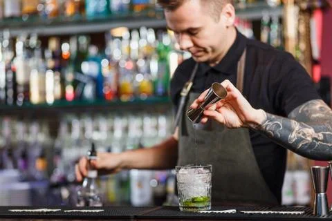The bartender making cocktail Stock Photos