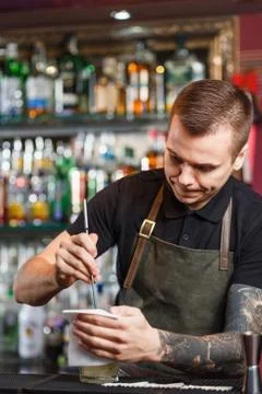 The bartender making cocktail Stock Photos