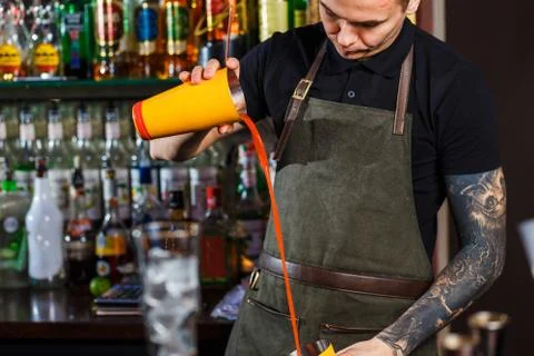 The bartender making cocktail Stock Photos