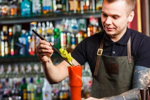 The bartender making cocktail Stock Photos