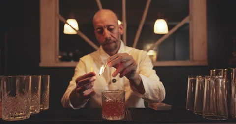 Bartender making a cocktail in speakeasy bar Stock Footage 144443035